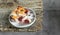 A slice of homemade clafoutis cherry pie - traditional french dessert in a gray plate