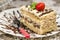 Slice of homemade nutty cake with strawberries served spoon