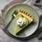 A slice of key lime pie with a dollop of whipped cream1