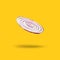 A slice of levitating red onion isolated on yellow background