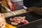 Slice medium rare beef steak grill on the pan with seasoning