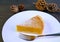 Slice of Mouthwatering Pumpkin Pie and Dry Pine Cones in the Backdrop