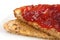 Slice of multi-seed wholegrain bread toasted and buttered with jam.