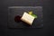 Slice of new york cheesecake on stone board on black background. Restaurant dessert menu