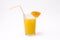 Slice of orange and glass of orange juice with straw