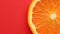 Slice of orange rotating close-up