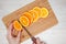 Slice of orange on wooden board.