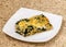 Slice of Ossetian pie with cheese and herbs