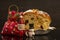 A slice of panettone next to Christmas ornaments