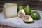 Slice of pecorino cheese with green figs