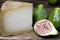 Slice of pecorino cheese with green figs