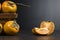 slice persimmon fruit on rustic background