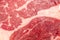 Slice of raw beef steak close-up, may be used as background or texture of beef meat