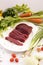 Slice raw ostrich meat with vegetable