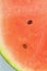 Slice of ripe watermelon in water. Close-up of watermelon in liquid with bubbles. Ripe red melon in sparkling water