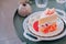 A slice of sponge cake on the plate, Strawberry shortcake with sliced strawberries on wooden table