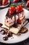 A slice of strawberry cheese cake with chocolate sauce, almond and fresh strawberry as the topping, fruit, food, delicious