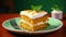 Slice of tasty sweet carrot sponge cake with cream decorated with mint leaf served on plate with spoon on table on colorful