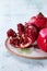 Slice and whole pomegranates
