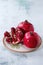 Slice and whole pomegranates