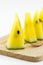 Slice yellow watermelon on wood plate isolated