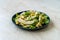 Sliced Artichoke with Broad Beans, Purslane Salad, Grated Parmesan Cheese and Olive Oil