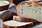 Sliced Artisan Bread with a Crisp Golden Crust on a Wooden Board