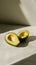 Sliced avocado on plain background