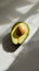 Sliced avocado on plain background