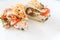 Sliced baked poultry fillet stuffed with soft cheese, tomatoes a