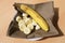 Sliced banana served ready to eat with napkin