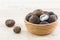 Sliced Barometer Earthstars mushroom in the wood bowl on wood ba