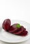 Sliced beet root on a white plate