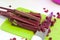 Sliced beet tops on a cutting Board. There`s a knife next to it