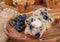 Sliced Blueberry Muffin With Butter and Spoonful of Berries