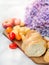 Sliced bread on wood, cheese and tomatoes, top view. hortensia flower