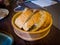 Sliced breads put on wooden plate,wholewheat breads lay on wood plate and put on sackcloth,whole wheat breads