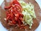 sliced Bulgarian green and red pepper on a cutting board