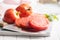 Sliced bull heart tomatoes on cutting board