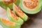 Sliced cantaloupe thai tropical fruit asian on wooden background - Cantaloupe Melon Muskmelon Cucurbitaceae