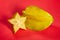 Sliced carambola starfruit on red