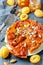 Sliced caramelized tarte tatin pie with apricots