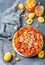 Sliced caramelized tarte tatin pie with apricots