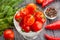 sliced cherry tomato bowl on wood