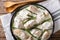 Sliced chicken with baby asparagus in cream sauce close-up on th