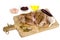 Sliced chicken fillet with spices on wooden kitchen cutting board