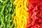 Sliced colourful paprika peppers background