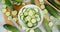 Sliced cucumber in a bowl and on a cutting Board with a cool steam.