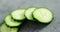 Sliced cucumber on concrete