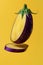 Sliced Eggplant Levitating on Yellow Backdrop